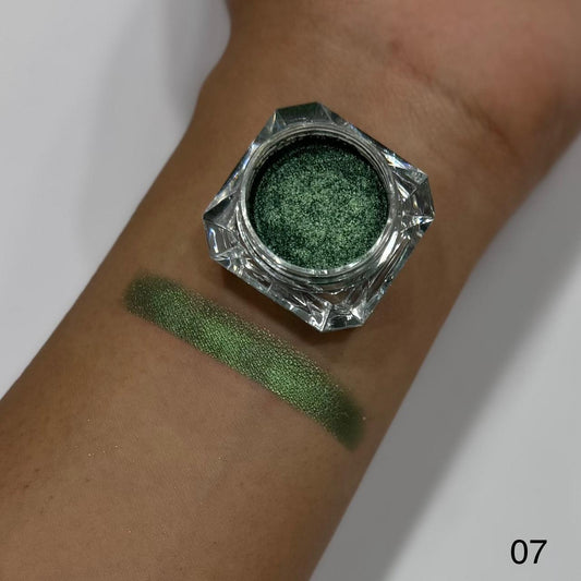 Green eyeshadow in a small jar with swatch on wrist, labeled '07'.
