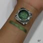Green eyeshadow in a small jar with swatch on wrist, labeled '07'.