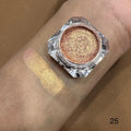 Gold glittery makeup product on a wrist with swatch