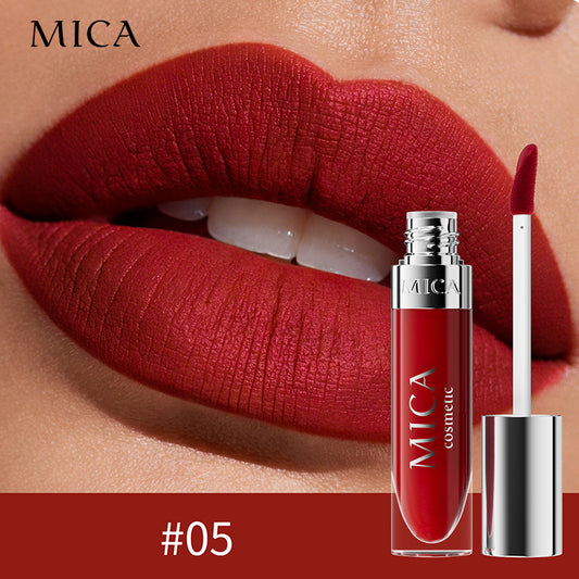 Red lipstick with MICA Cosmetics branding on a close-up of lips.