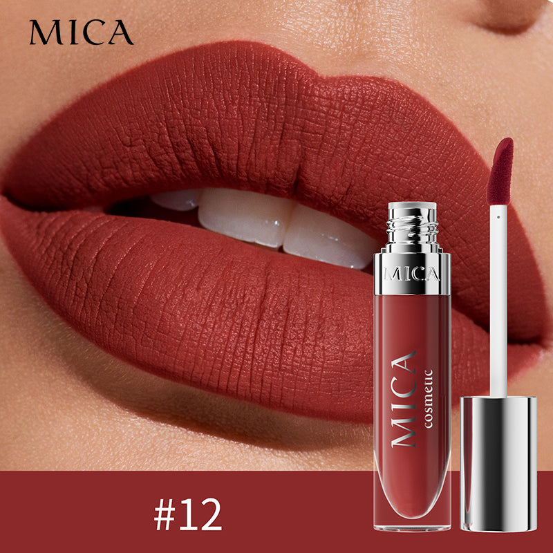 MICA cosmetic lipstick with applicator on a close-up of lips