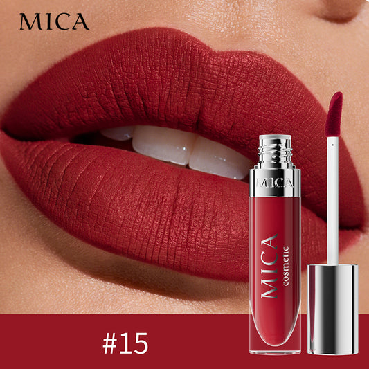 Red lipstick with MICA cosmetic packaging on a close-up of lips.